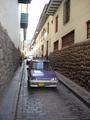 [Photo of a street in Cusco]